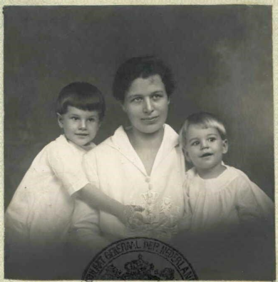 black and white photo of woman and two children