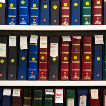 Colourful folders on shelves